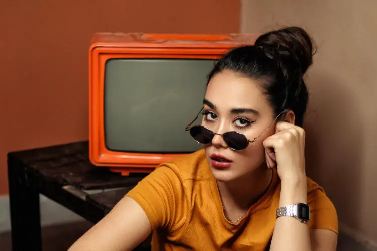 Girl with glasses and tv